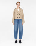cropped trench coat in beige, buttoned, front view on model